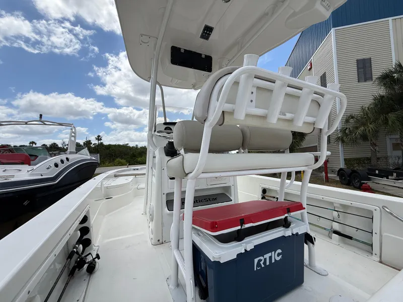 Slide: The Image of 2015 NauticStar 244 XTS boat with seating and RTIC cooler on deck. - 9