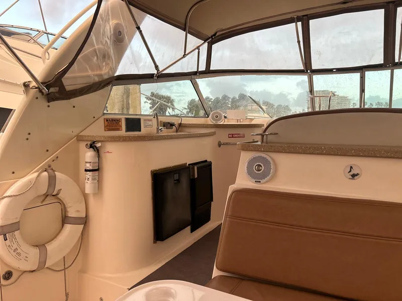 Slide: The Image of 2005 Rinker Fiesta Vee 410 boat interior with seating and safety equipment. - 14