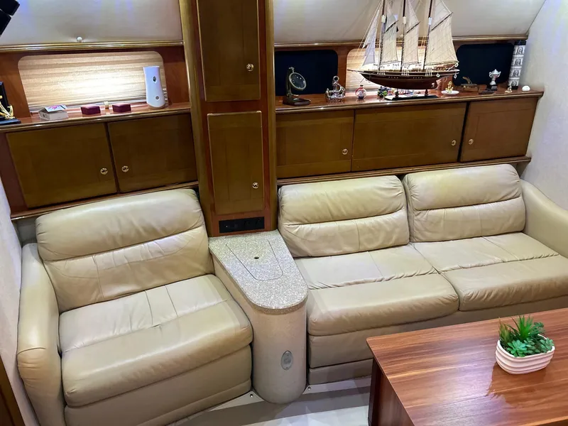 Slide: The Image of Luxurious interior of 2005 Rinker Fiesta Vee 410 yacht with leather seating and wooden cabinetry. - 24