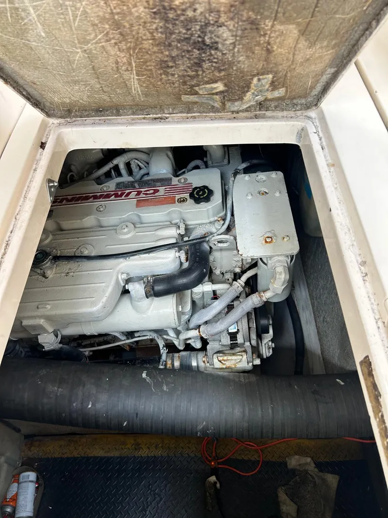 Slide: The Image of Engine compartment of a 2005 Rinker Fiesta Vee 410 boat, showcasing the engine details. - 33