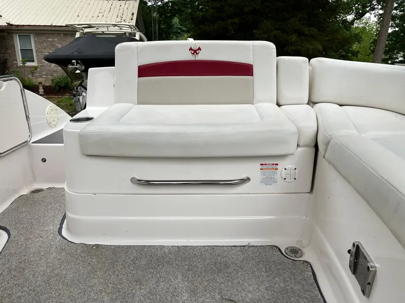 Slide: The Image of 2013 Chaparral 224 Xtreme boat interior with white seating and red accent. - 17