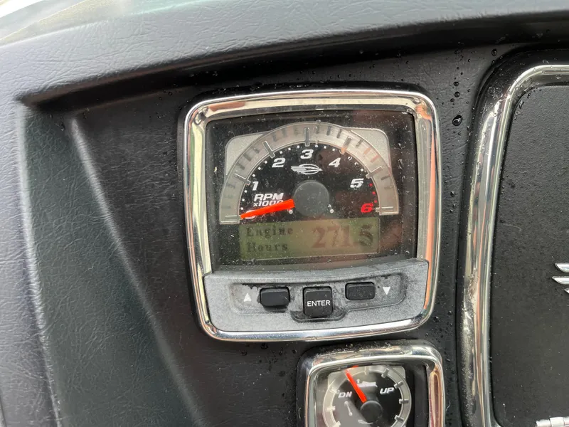 Slide: The Image of Dashboard of 2013 Chaparral 224 Xtreme showing RPM gauge and controls. - 18