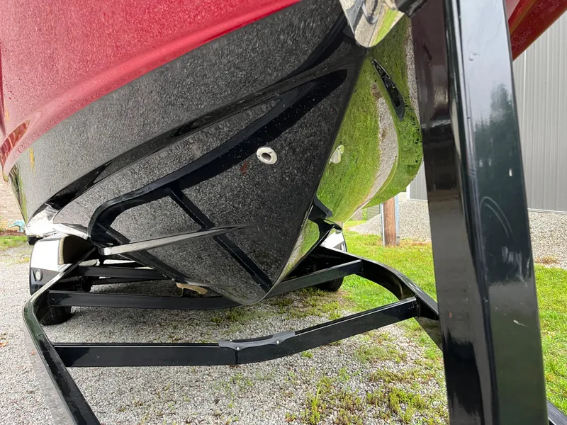 Slide: The Image of 2013 Chaparral 224 Xtreme boat hull on trailer, red and black finish. - 28