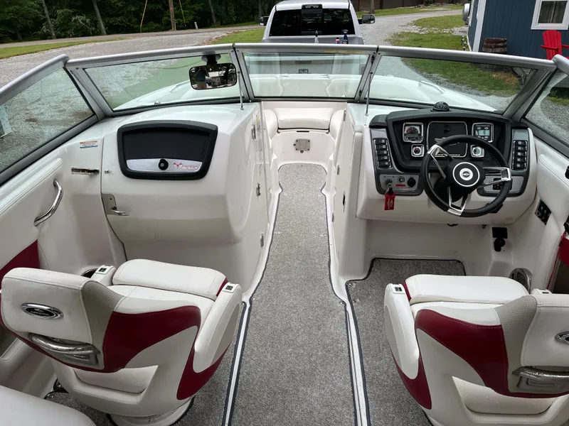 Slide: The Image of Interior view of 2013 Chaparral 224 Xtreme boat with dual seats and steering console. - 7