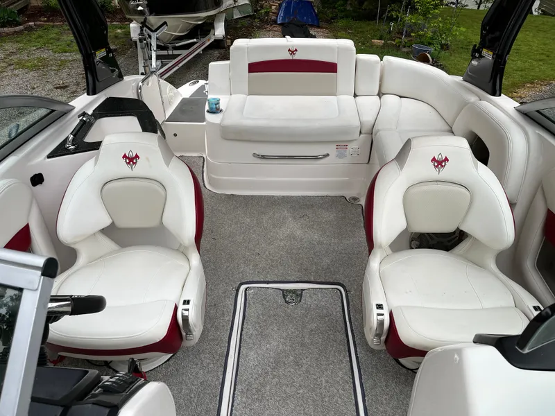 Slide: The Image of 2013 Chaparral 224 Xtreme boat interior with white and red seating. - 8