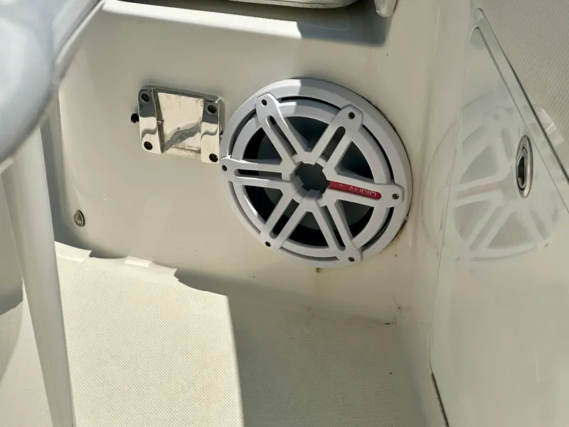 Slide: The Image of 2019 Wellcraft 262 Fisherman boat interior with marine speaker and stainless steel fixture. - 5