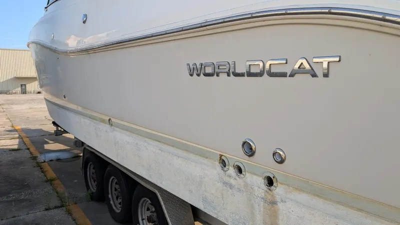 Slide: The Image of 2016 World Cat 320 DC boat on trailer, side view. - 19
