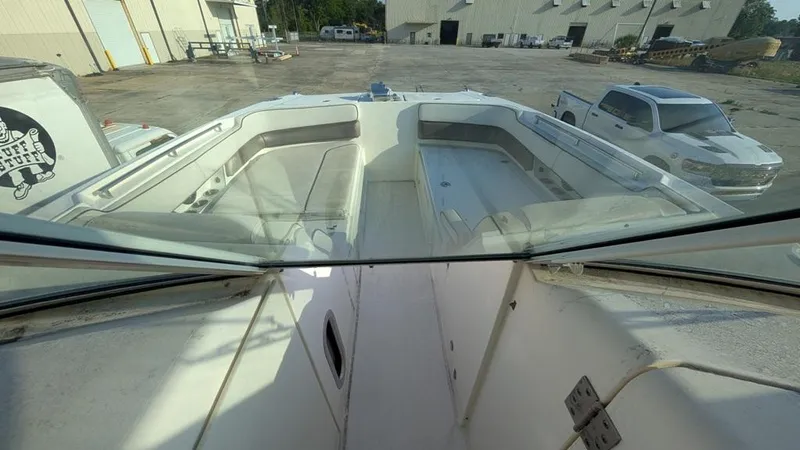 Slide: The Image of 2016 World Cat 320 DC boat interior view at a dockyard. - 8