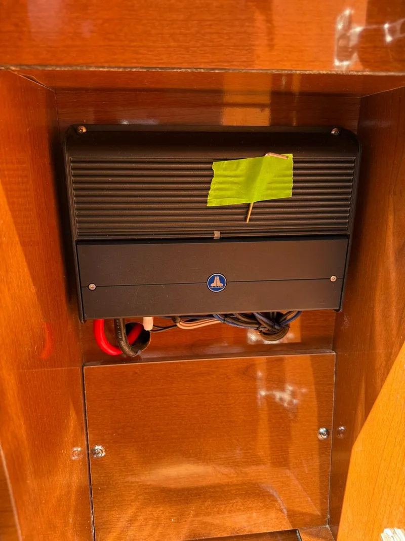 Slide: The Image of 2009 Sea Ray 250 Sundancer electrical component with wiring in wooden compartment. - 9