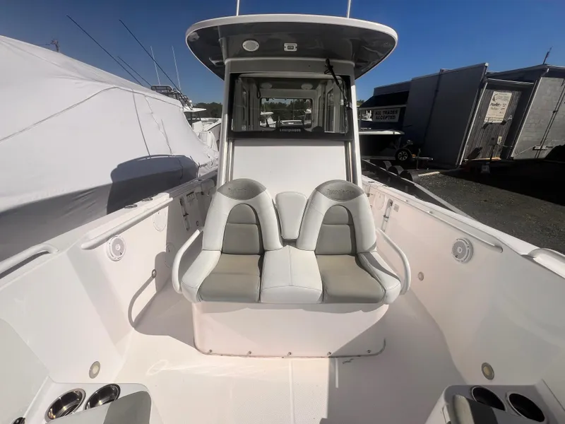 Slide: The Image of 2015 Everglades 295 Pilot boat interior with dual seats and cockpit view. - 8