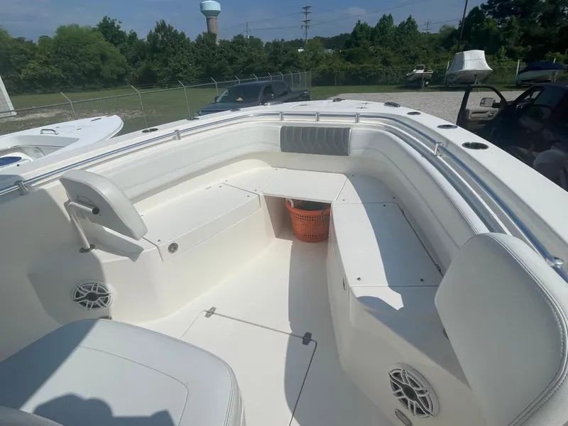Slide: The Image of 2020 Cobia 262 Center Console boat interior with seating and storage. - 10