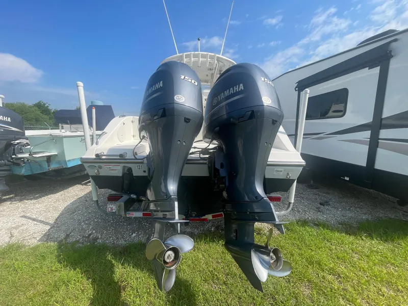 Slide: The Image of 2020 Cobia 262 Center Console with twin Yamaha outboard engines on a trailer. - 4