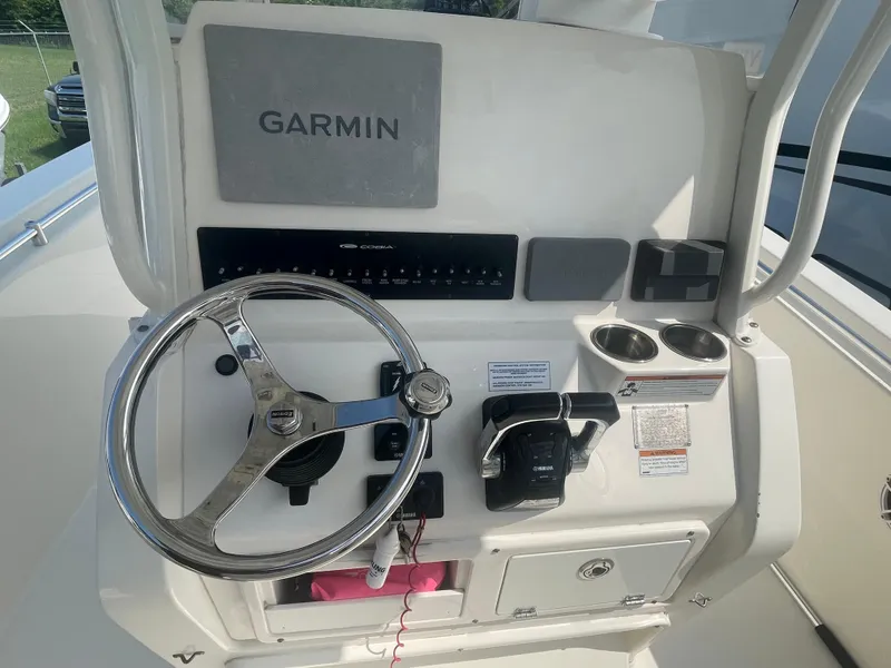 Slide: The Image of 2020 Cobia 262 Center Console boat dashboard with Garmin navigation system. - 9