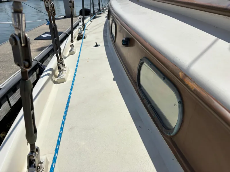 Slide: The Image of 1955 Hinckley 36 Auxiliary Yawl deck view with rigging and porthole. - 13
