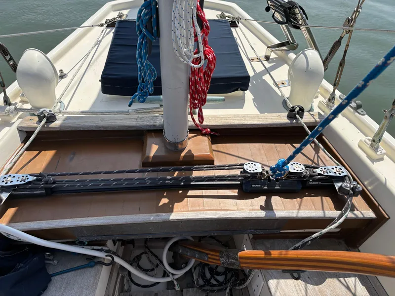 Slide: The Image of 1955 Hinckley 36 Auxiliary Yawl deck with rigging and ropes, showcasing classic sailing design. - 19