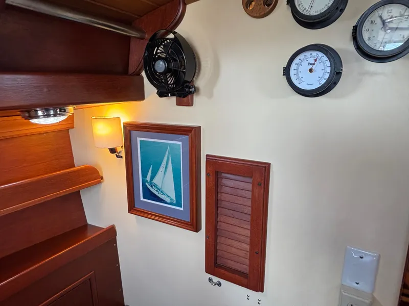 Slide: The Image of Interior of 1955 Hinckley 36 Auxiliary Yawl with nautical decor and instruments. - 35