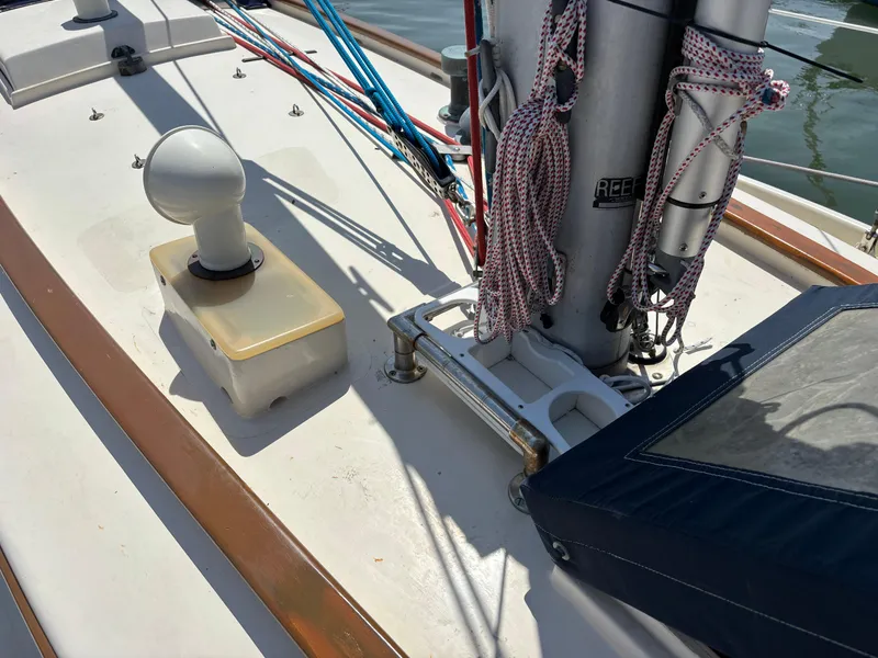 Slide: The Image of 1955 Hinckley 36 Auxiliary Yawl deck with ropes and mast details. - 10