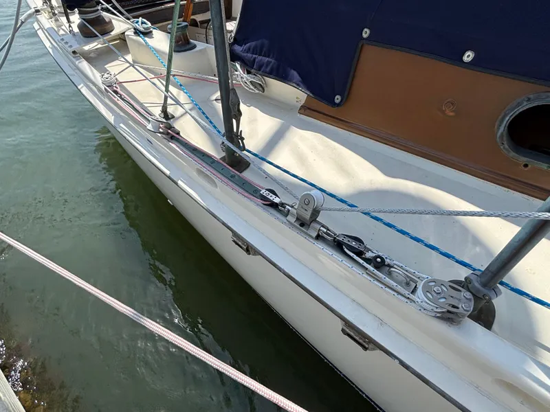 Slide: The Image of Hinckley 36 Auxiliary Yawl, 1955, deck view with rigging and water reflection. - 21