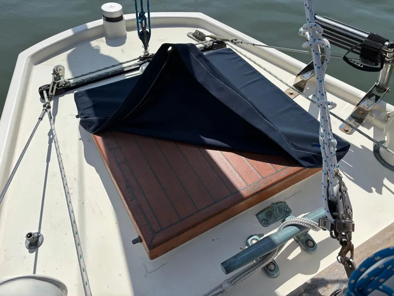 Slide: The Image of Hinckley 36 Auxiliary Yawl 1955 deck with wooden hatch and navy cover. - 25