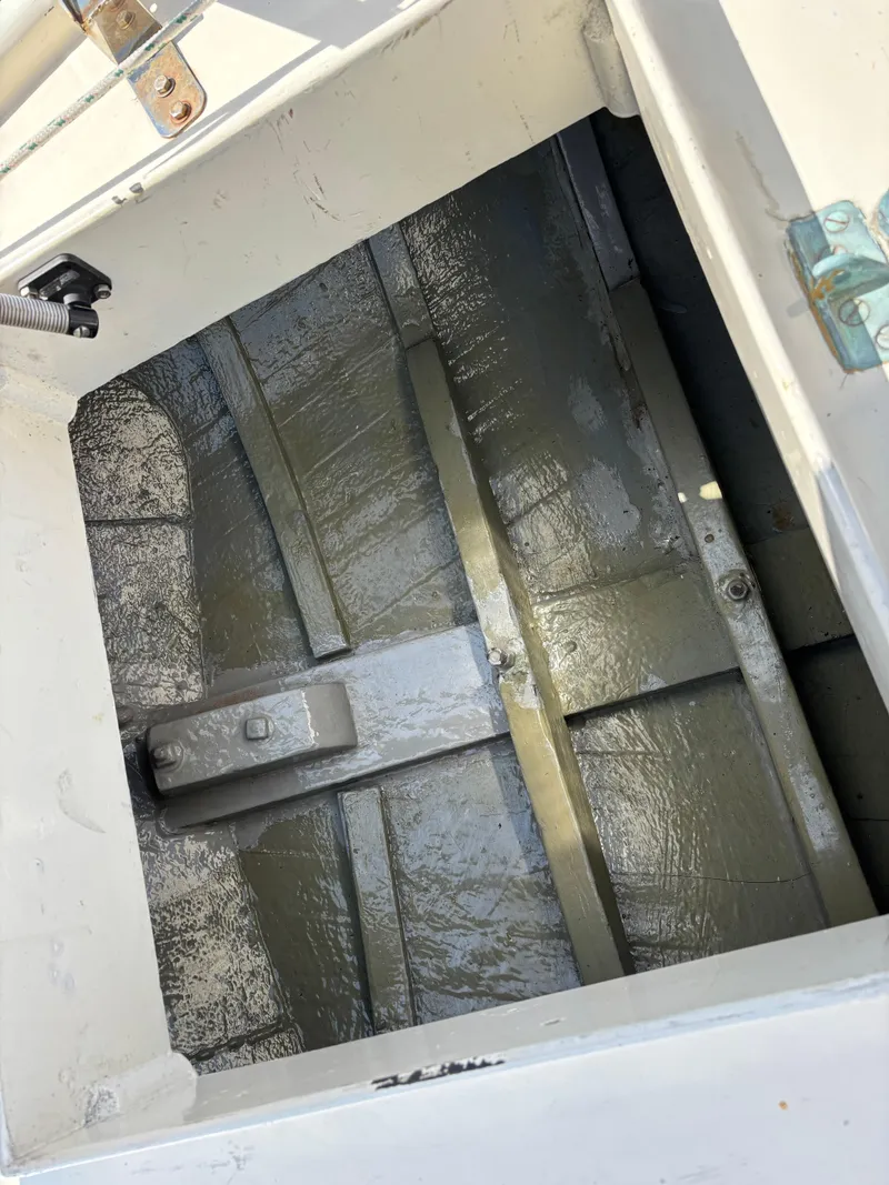 Slide: The Image of Interior view of a 1955 Hinckley 36 Auxiliary Yawl, showcasing the boat's structural details. - 26
