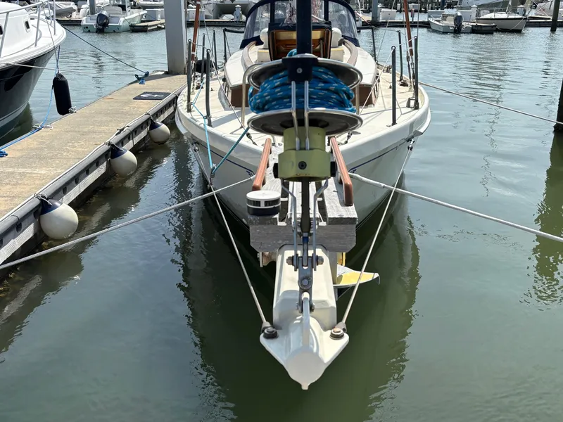 Slide: The Image of Hinckley 36 Auxiliary Yawl, 1955, docked at marina, front view. - 3