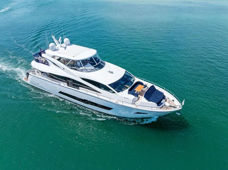 Slide: The Image of 2019 Sunseeker 86 Yacht cruising on clear blue waters. - 11