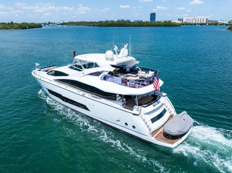 Slide: The Image of Luxurious 2019 Sunseeker 86 Yacht cruising on clear blue waters. - 15