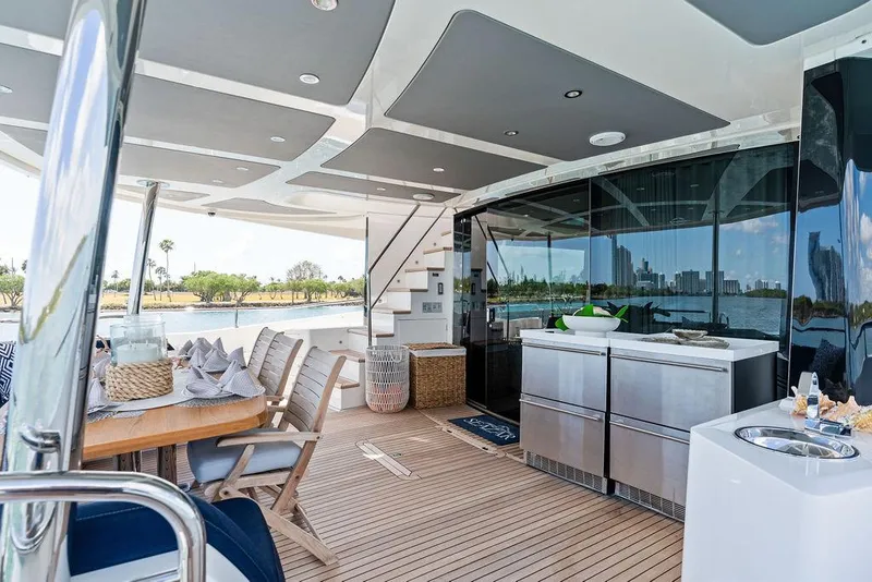 Slide: The Image of Luxurious 2019 Sunseeker 86 Yacht deck with dining area and modern amenities. - 17