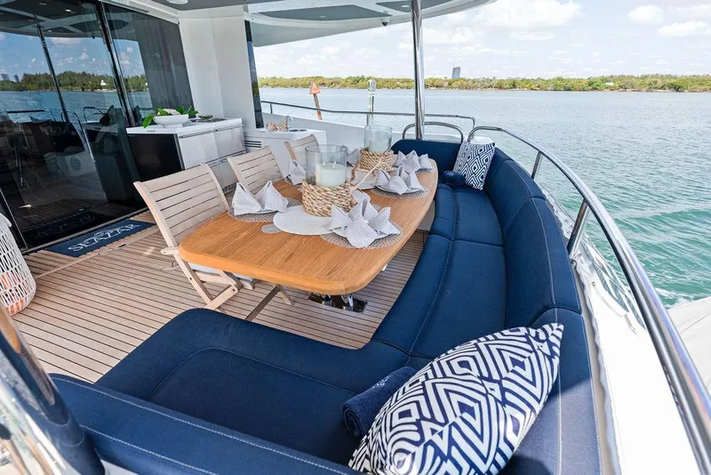 Slide: The Image of Luxurious Sunseeker 86 Yacht 2019 with elegant outdoor dining area and scenic water view. - 22