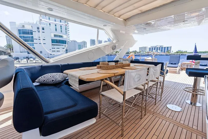 Slide: The Image of Luxurious Sunseeker 86 Yacht 2019 with elegant outdoor seating and dining area. - 25