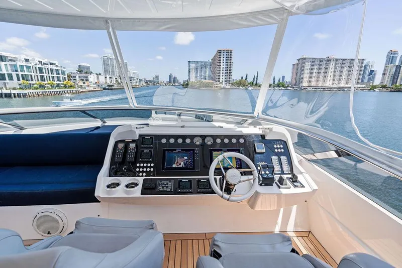Slide: The Image of Helm of 2019 Sunseeker 86 Yacht with city skyline view. - 36