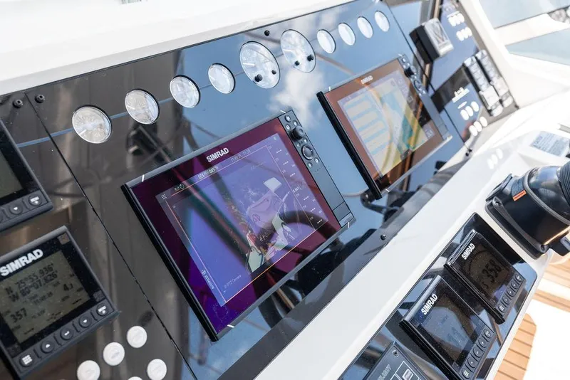 Slide: The Image of Control panel of 2019 Sunseeker 86 Yacht with navigation screens and gauges. - 37