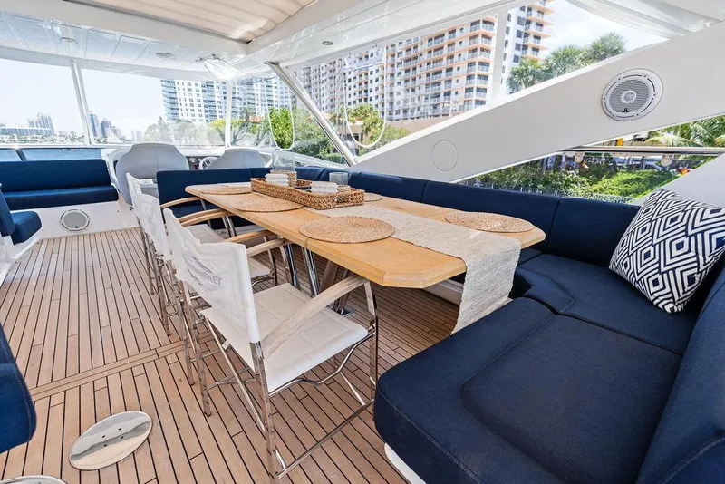 Slide: The Image of Luxurious Sunseeker 86 Yacht 2019 with elegant outdoor dining area and modern seating. - 40