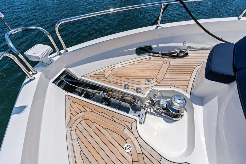 Slide: The Image of Sunseeker 86 Yacht 2019 deck with teak flooring and anchor system. - 45