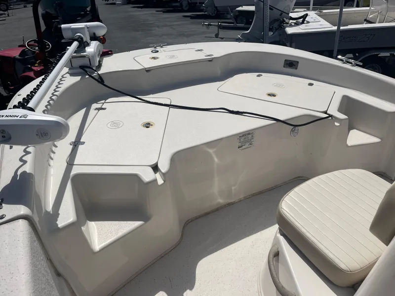 Slide: The Image of 2017 Carolina Skiff 178 DLV boat deck with seating and storage compartments. - 6