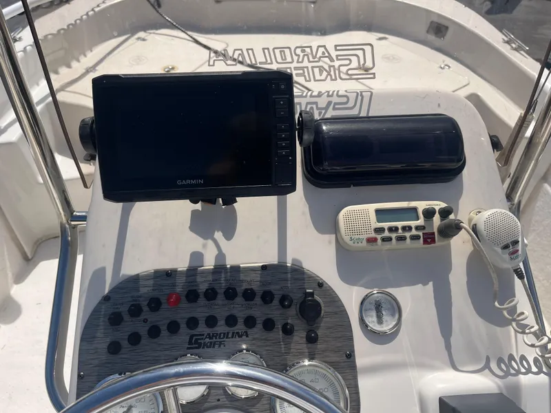 Slide: The Image of 2017 Carolina Skiff 178 DLV console with Garmin display and marine radio. - 8