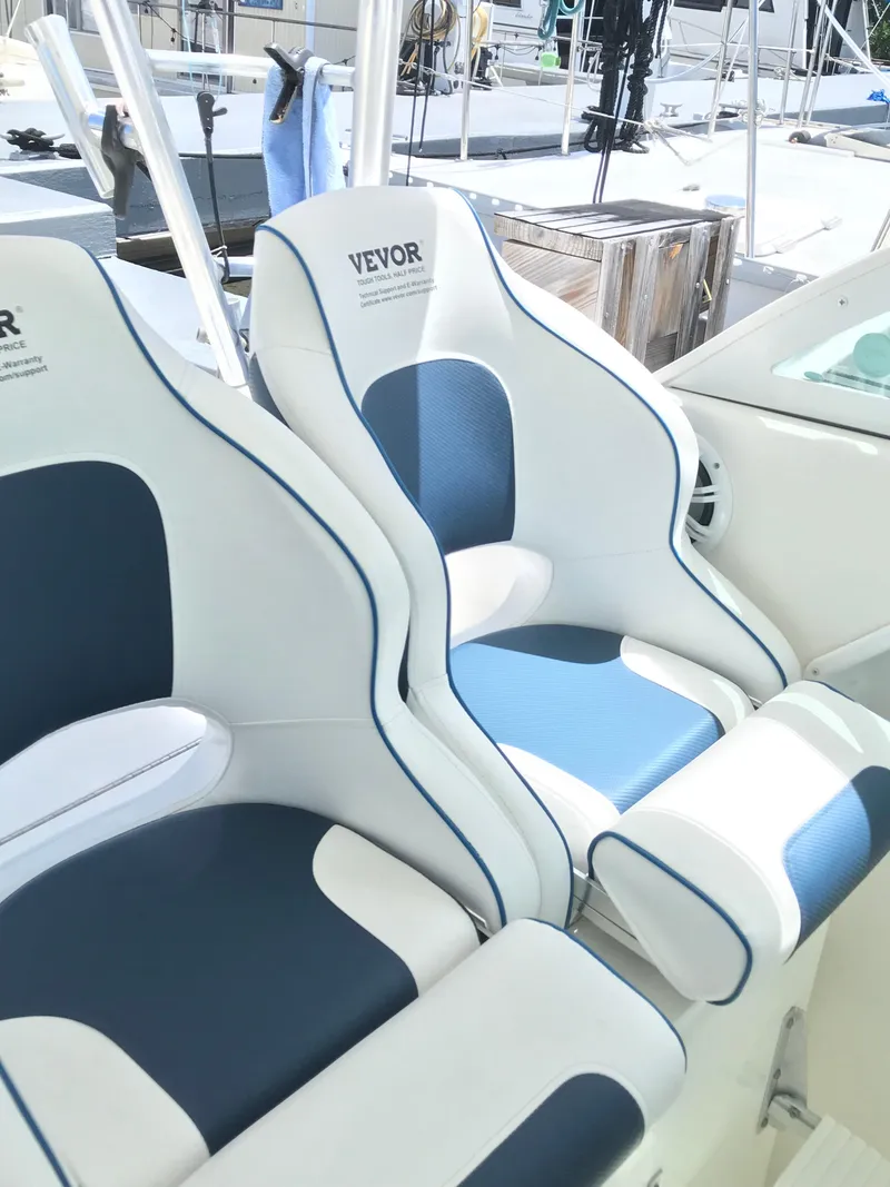 Slide: The Image of 2005 Rampage 30' Express Sportfish boat seats with blue and white upholstery. - 11