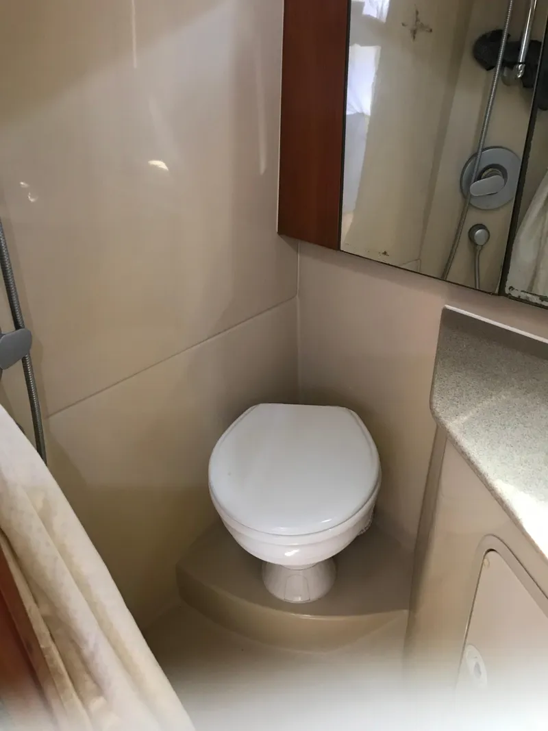 Slide: The Image of 2005 Rampage 30' Express Sportfish bathroom with toilet and shower. - 25