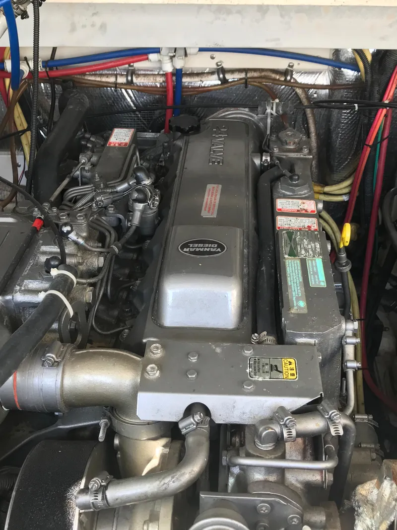 Slide: The Image of Engine of 2005 Rampage 30' Express Sportfish with visible wiring and components. - 40