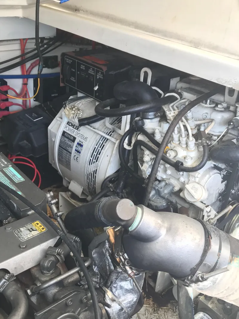 Slide: The Image of Engine compartment of a 2005 Rampage 30' Express Sportfish boat. - 42