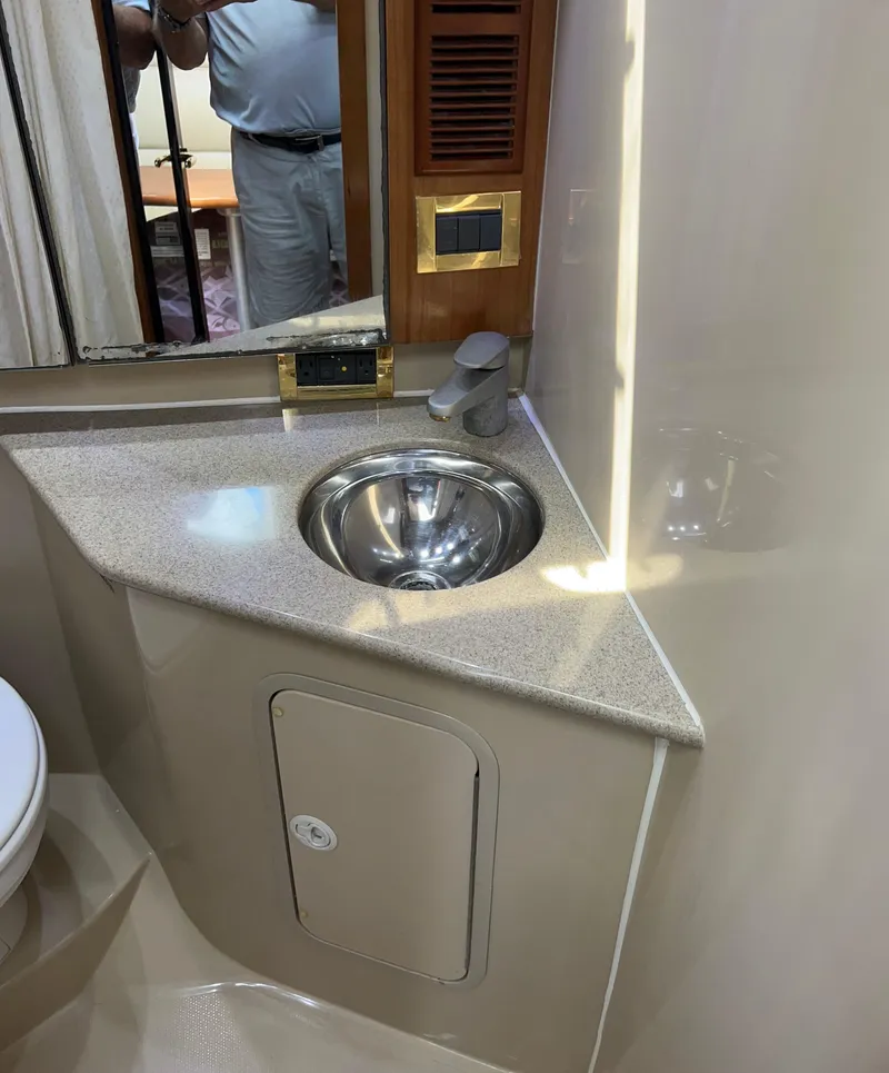 Slide: The Image of 2005 Rampage 30' Express Sportfish bathroom with sink and mirror. - 48