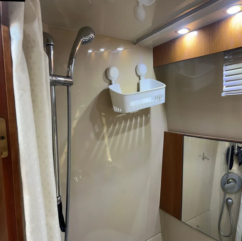Slide: The Image of Shower area in 2005 Rampage 30' Express Sportfish boat with modern fixtures. - 49