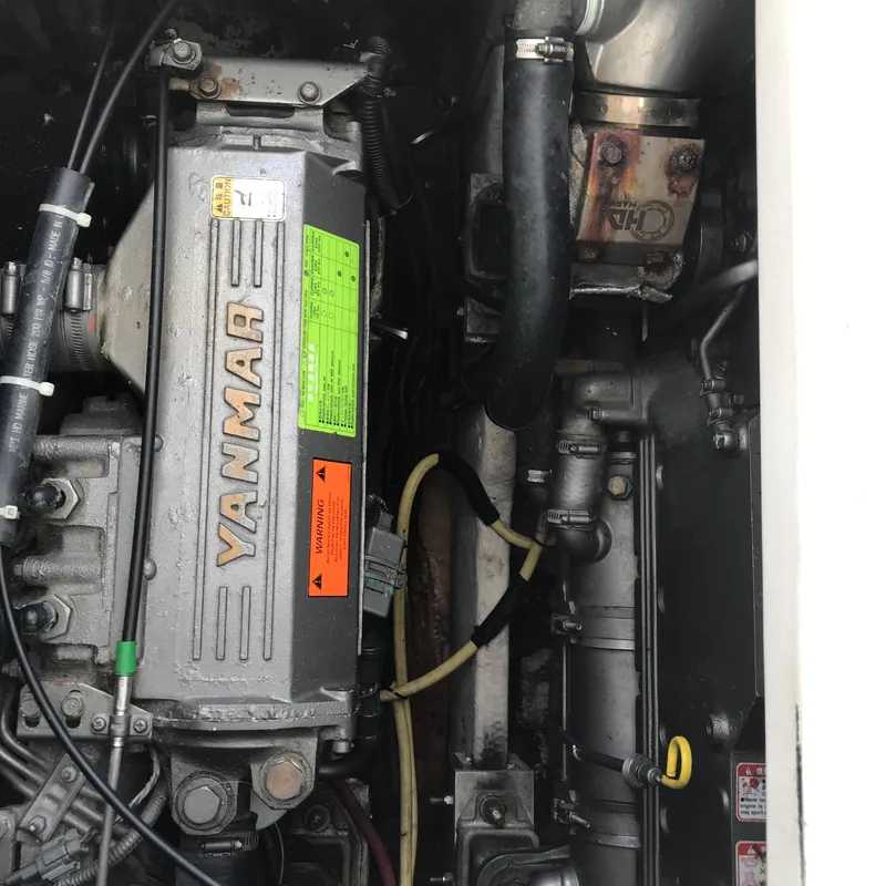 Slide: The Image of Engine compartment of 2005 Rampage 30' Express Sportfish with Yanmar engine. - 5