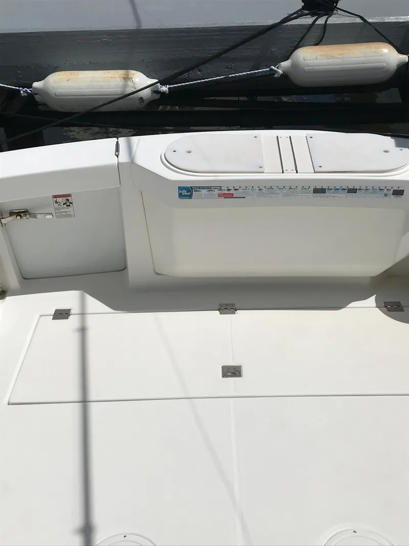 Slide: The Image of 2005 Rampage 30' Express Sportfish boat deck with storage compartments. - 7