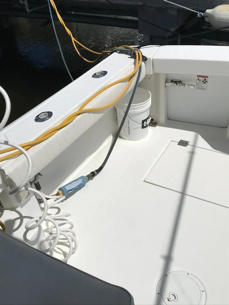 Slide: The Image of 2005 Rampage 30' Express Sportfish boat deck with cables and equipment. - 8