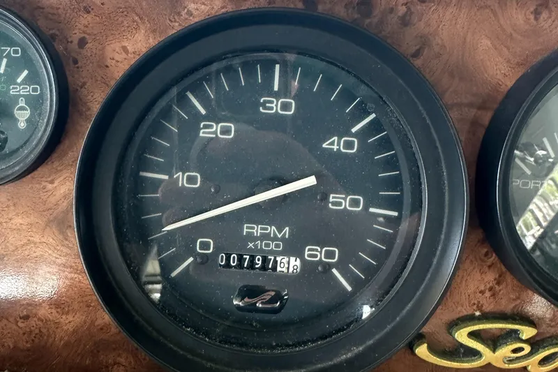 Slide: The Image of Tachometer of 1994 Sea Ray 370 Express Cruiser showing 797.6 RPM x100. - 23