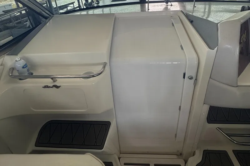 Slide: The Image of 1994 Sea Ray 370 Express Cruiser interior with sleek white design and modern amenities. - 29