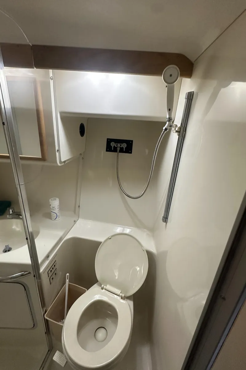 Slide: The Image of 1994 Sea Ray 370 Express Cruiser bathroom with shower and toilet. - 40