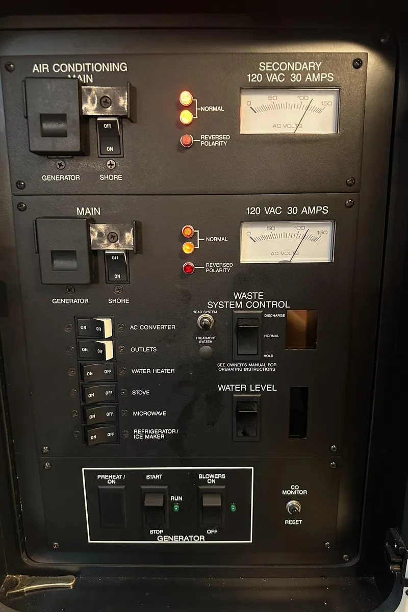 Slide: The Image of Electrical control panel of a 1994 Sea Ray 370 Express Cruiser boat. - 44