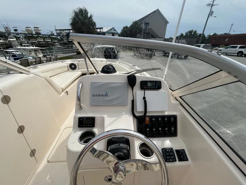 Slide: The Image of 2022 Grady-White Freedom 215 boat dashboard with Garmin navigation system. - 12